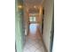 Inviting entryway with tile flooring, coat closet, and an open view into the living area at 5014 Barrington Cir # 2102, Sarasota, FL 34234