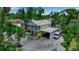 Aerial view of charming two-story home, lush landscaping, and convenient carport at 508 Howard Ct, Sarasota, FL 34236