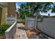 Secluded backyard with white fencing and brick pavers offering a private outdoor space at 508 Howard Ct, Sarasota, FL 34236