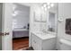 Bright bathroom with modern fixtures, a single sink vanity, a toilet, and access to the bedroom at 508 Howard Ct, Sarasota, FL 34236