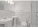 Bathroom featuring double sinks with marble-like tile at 508 Howard Ct, Sarasota, FL 34236