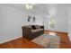 Well-lit bedroom with two ceiling fans, wood floors, and a window with blinds at 508 Howard Ct, Sarasota, FL 34236