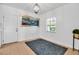 Bright dining room featuring tile floors, a modern light fixture, and a large window at 508 Howard Ct, Sarasota, FL 34236