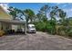 Spacious driveway featuring covered parking with an open design and enough space for multiple vehicles at 508 Howard Ct, Sarasota, FL 34236