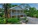 Charming two-story home with double balconies, lush landscaping, and cozy pergola at 508 Howard Ct, Sarasota, FL 34236