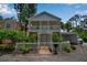 Charming two-story home with a white picket fence and well-maintained landscaping, plus a covered parking area at 508 Howard Ct, Sarasota, FL 34236