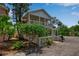 Charming two-story home with a white picket fence and well-maintained landscaping, plus a covered parking area at 508 Howard Ct, Sarasota, FL 34236
