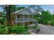 Charming two-story home with double balconies, lush landscaping, and cozy pergola at 508 Howard Ct, Sarasota, FL 34236