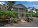 Charming two-story home with a white picket fence and well-maintained landscaping, plus a covered parking area at 508 Howard Ct, Sarasota, FL 34236