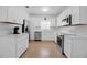 Bright, renovated kitchen featuring stainless steel appliances and ample white cabinetry at 508 Howard Ct, Sarasota, FL 34236