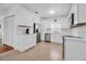 Bright white kitchen featuring stainless steel appliances, ample counter space, and tiled flooring at 508 Howard Ct, Sarasota, FL 34236