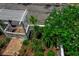 Aerial view of a lush landscaped yard featuring a pergola and diverse plants, showcasing the greenery at 508 Howard Ct, Sarasota, FL 34236