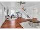 Bright living room with wood floors, a staircase, and a comfortable seating area at 508 Howard Ct, Sarasota, FL 34236