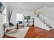 Cozy living room featuring wood floors, a staircase, and lots of natural light at 508 Howard Ct, Sarasota, FL 34236
