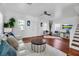 Open living room with white walls, hardwood floors, and a comfortable seating arrangement at 508 Howard Ct, Sarasota, FL 34236