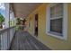 Charming porch with weathered wood floors, adding great space and character at 508 Howard Ct, Sarasota, FL 34236