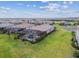 Aerial view showcasing the community's homes and their proximity to natural ponds and lush greenery at 5117 Marina Basin Ct, Bradenton, FL 34211