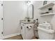 Stylish bathroom featuring a modern vanity, sleek black fixtures, and decorative shelving adding charm at 5117 Marina Basin Ct, Bradenton, FL 34211