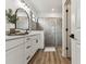 Modern bathroom featuring double vanity with vessel sinks and a glass-enclosed shower at 5117 Marina Basin Ct, Bradenton, FL 34211