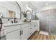 Bright bathroom with a double vanity, modern fixtures, and a tiled shower at 5117 Marina Basin Ct, Bradenton, FL 34211