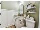 Stylish bathroom featuring a modern vanity, sleek black fixtures, and decorative shelving adding charm at 5117 Marina Basin Ct, Bradenton, FL 34211