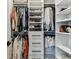 Organized walk-in closet with shelving, drawers, and hanging rods provides ample storage space at 5117 Marina Basin Ct, Bradenton, FL 34211