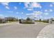 Gated community entrance with brick paved roundabout and well maintained landscaping at 5117 Marina Basin Ct, Bradenton, FL 34211