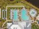 Aerial view of the pools, waterpark, clubhouse, bocce ball court and putting green at the community center at 5117 Marina Basin Ct, Bradenton, FL 34211