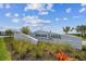 A view of the Lorraine Lakes at Lakewood Ranch community sign with plants in the foreground at 5117 Marina Basin Ct, Bradenton, FL 34211