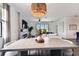 Open-concept space features a modern dining area with kitchen and living room views, and great natural lighting at 5117 Marina Basin Ct, Bradenton, FL 34211