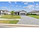 Charming single-story home with a well-manicured lawn and paved driveway at 5117 Marina Basin Ct, Bradenton, FL 34211