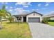 Charming single-Gathering home with manicured lawn and paved driveway at 5117 Marina Basin Ct, Bradenton, FL 34211