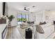 Airy living room with a large sectional sofa and access to a screened patio and outdoor pool area at 5117 Marina Basin Ct, Bradenton, FL 34211