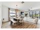 Open concept living and dining area with hardwood floors and backyard access at 5117 Marina Basin Ct, Bradenton, FL 34211