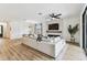 Comfortable living area with fireplace, large sectional couch, and hardwood floors at 5117 Marina Basin Ct, Bradenton, FL 34211