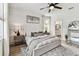 Bright and airy main bedroom suite with an en-suite bathroom, large bed, and neutral décor at 5117 Marina Basin Ct, Bradenton, FL 34211