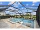 Gorgeous screened pool with a spa and lounge chairs, backing to a serene water view at 5117 Marina Basin Ct, Bradenton, FL 34211
