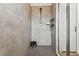 Modern walk-in shower with gray tile and a sleek showerhead at 5117 Marina Basin Ct, Bradenton, FL 34211