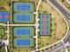 Overhead view of a tennis, basketball court and putting green in this Primary-planned community at 5117 Marina Basin Ct, Bradenton, FL 34211