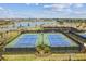 Aerial view of the community tennis courts near the lake at 5117 Marina Basin Ct, Bradenton, FL 34211