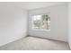 Light-filled bedroom featuring a large window with a view of a palm tree at 5121 Sultana Cv, Bradenton, FL 34211