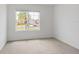 Bright, empty bedroom with natural light streaming through the window at 5121 Sultana Cv, Bradenton, FL 34211