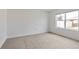 Vacant bedroom with carpet flooring and a large window at 5121 Sultana Cv, Bradenton, FL 34211