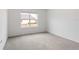 Vacant carpeted bedroom with a bright window at 5121 Sultana Cv, Bradenton, FL 34211