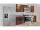 The kitchen showcases stainless steel appliances and rich dark cabinets at 5121 Sultana Cv, Bradenton, FL 34211