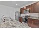 A kitchen area boasting granite countertops and stainless steel appliances at 5121 Sultana Cv, Bradenton, FL 34211