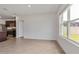 Bright living room with tile flooring and a view to the backyard at 5121 Sultana Cv, Bradenton, FL 34211
