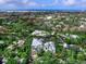Scenic aerial view showcasing the community's waterfront homes, canals, and the Gulf of Mexico in the distance at 5132 Jungle Plum Rd, Sarasota, FL 34242