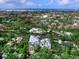 Scenic aerial view showcasing the community's waterfront homes, canals, and the Gulf of Mexico in the distance at 5132 Jungle Plum Rd, Sarasota, FL 34242