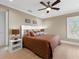 Neutral bedroom with natural light, wood floors, a fan and calming colors for a restful retreat at 5132 Jungle Plum Rd, Sarasota, FL 34242